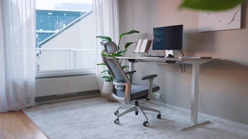 Home Office Desk And Chair With Desktop Computer Near The Open Window. - wide