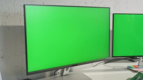 Two Green Screen Monitors at Light Office Table Zoom Out Woman Working Mockup