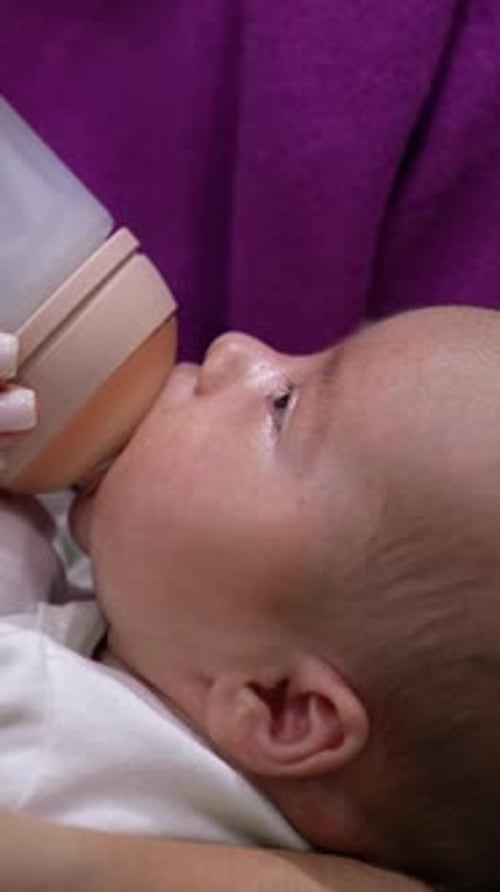 Infant Being Bottle Fed, Close-Up