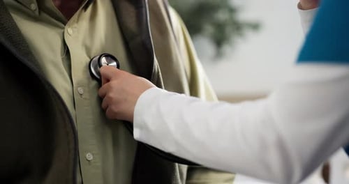 Hands, patient and nurse with stethoscope for checkup, consultation and chest wellness in hospital