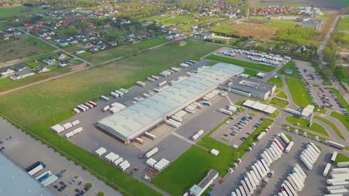 Aerial view of goods warehouse. Logistics center in industrial city zone from above. Aerial view of