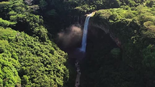 Aerial view of Chamarel waterfall amidst green trees, Mauritius.