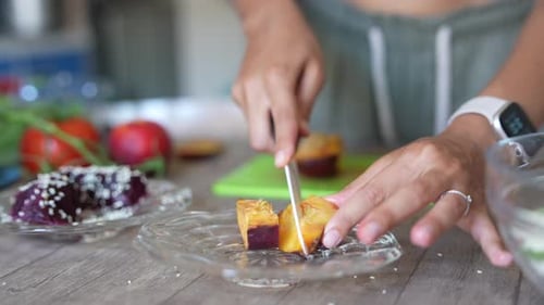 Woman Prepares Healthy Salad in Kitchen