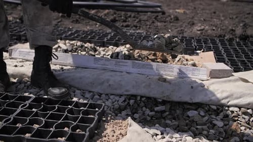 Builder Works with a Shovel