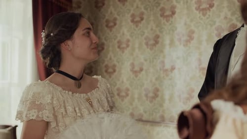 Woman in Historical Clothing Conversing with Man