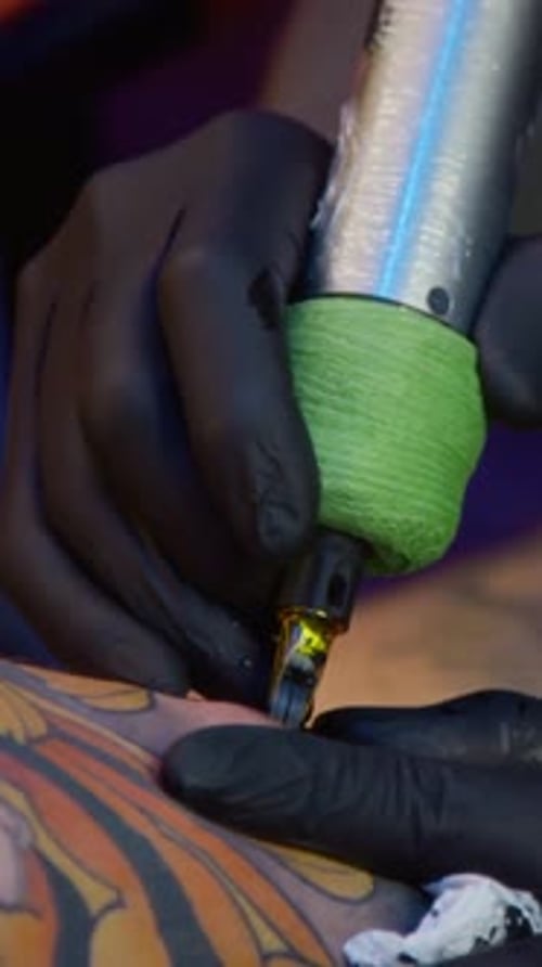 Vertical of Unrecognizable Tattoo Specialist Applying Ink on Skin