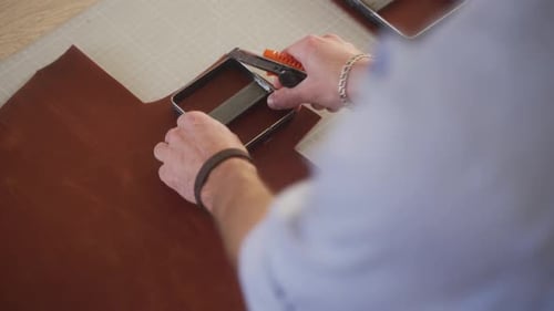 Leather Craftsman Works in His Workshop Master Making Leather Products Man Carves Leather Sheet