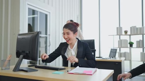 Team young diverse colleagues working together and celebrating success at office