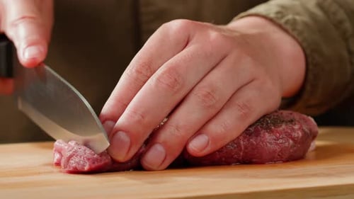 Man Chef Cooking Beef Steak Angus Closeup Professional Cheif Preparing Meat in Restaurant Kitchen