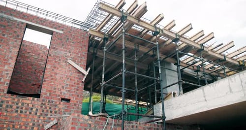 Scaffolding, construction or empty site with brick wall for building progress