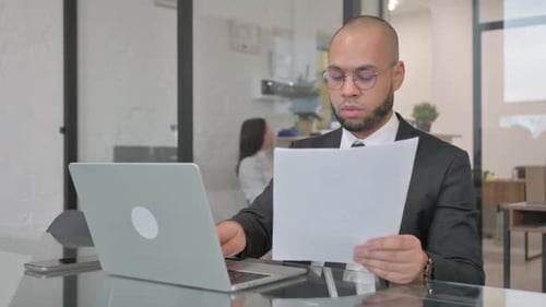 Professional Young Adult Working in Modern Office