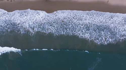 Aerial View of the Pacific Ocean Waves Hitting the Cliff Rocks