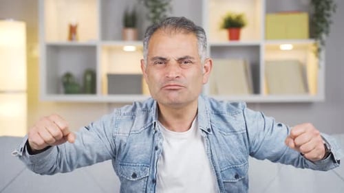 Man getting angry at camera.
