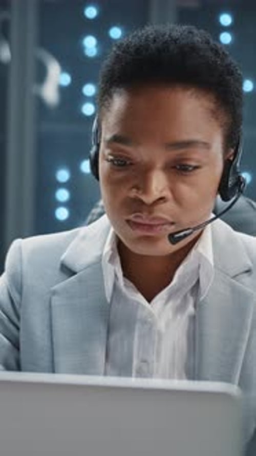 African American IT Customer Support Operator Woman Wearing Headset Speaker Consulting Customers