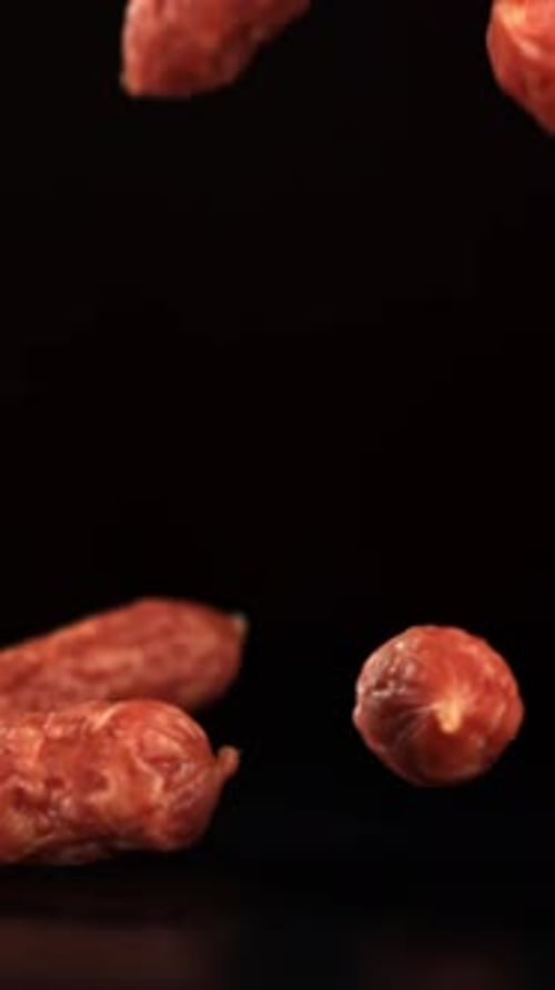 Mini Salami Fall on a Black Table Filmed on a Highspeed Camera at 1000 Fps