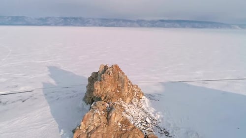 Aerial View on Shamanka Rock on Olkhon Island in the Morning Winter Landscape of Lake Baikal Famous