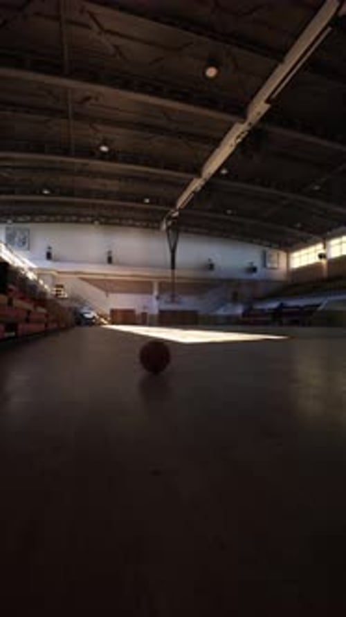 Basketball Ball in Empty College Gym
