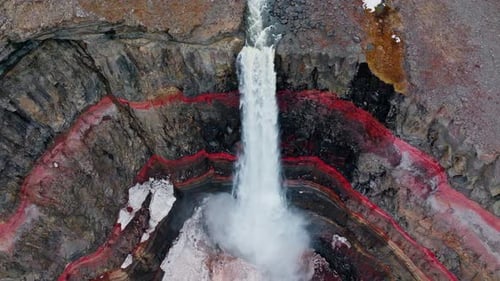 Waterfall Over Red Canyon Rocks