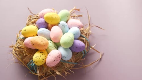 Easter Concept with Multi Color Egg on Pink Background