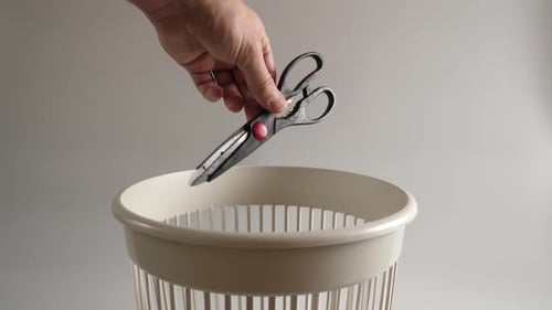 27. Old kitchen scissors are thrown into the trash for recycling