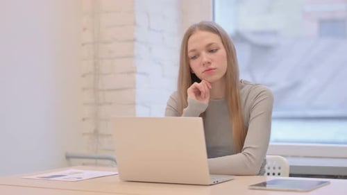 Woman working at computer in office