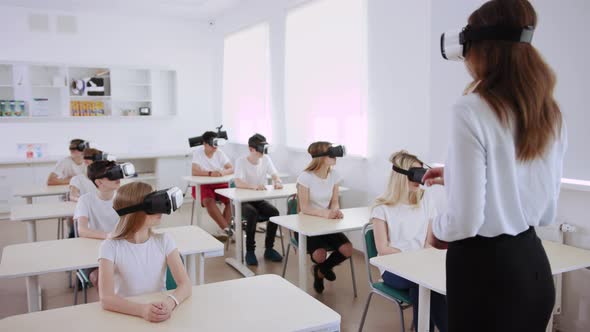 Students and Teacher Using VR Headsets in Classroom, Technology Stock ...