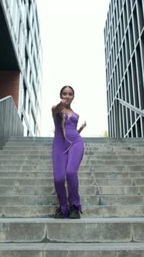 Stylish Woman Dancing on Urban Steps