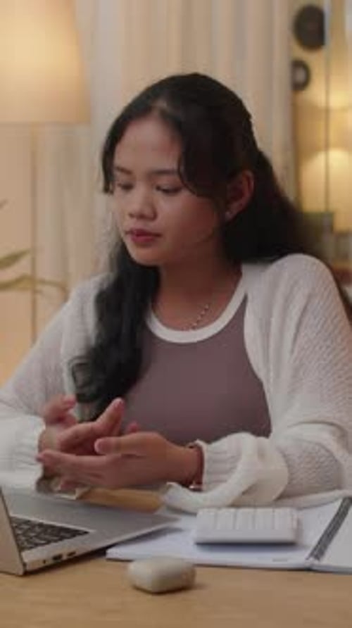 Young Woman in Online Meeting at Home