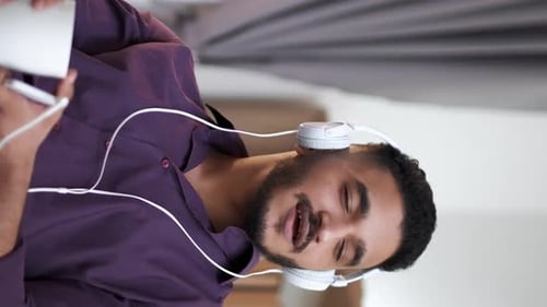 Adult Listening to Music and Drinking