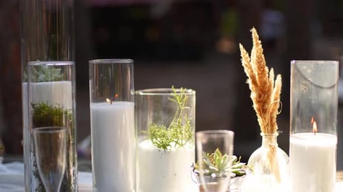 Wedding Party Banquet Outdoors in Forest Dining Table Decorated in Boho Style with Candles White