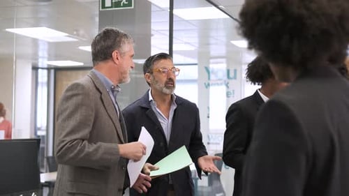 Angry Manager Scolding Employees in Creative Office