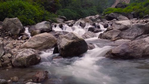 mountain stream timelapse while sunset
