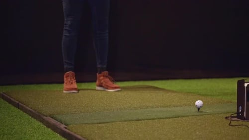 Cropped Image Of A Person Practicing Golf With Golf Club Swinging. slow motion