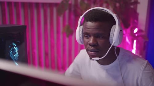 Young Adult Gaming at Home at Night