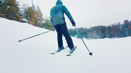 Skier glides down the slope