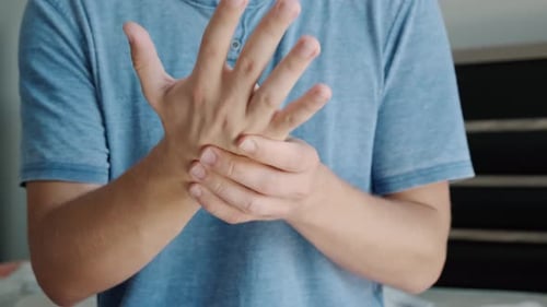 Man Suffering From Hand and Wirst Pain Male Massaging Painful Hand Hurting From Carpal Tunnel