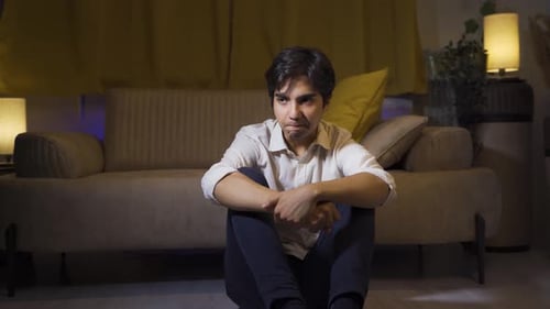 Man having a nervous breakdown at home is shouting.