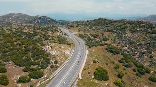 Motorbike Riders Professional Touring Motorcyclists on Stunning Mountain Road in Mountain