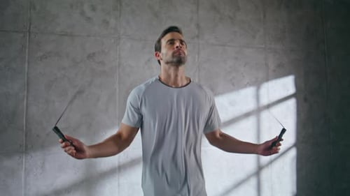 Closeup Fitness Man Jumping in Loft Sport Club Athlete Using Skipping Rope