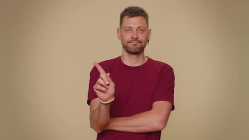 Man Shakes Head No and Holds Up Finger
