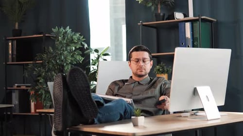 Happy Relax Male Boss Leader Manager Typing Message Putting Legs on the Table