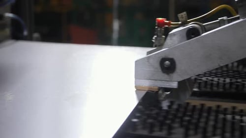 Manipulator Transports Thin Metal Sheet at Production Line