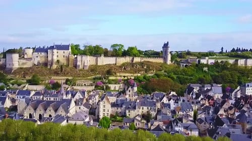 Panning left across the riverfront of Chateau Chinon in Loire Valley France