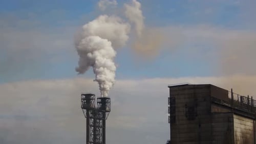 Smoke From Pipes of the Industrial Plant in the City