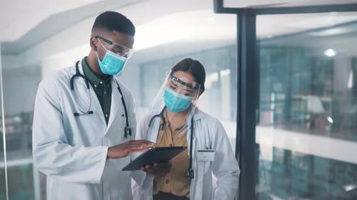 Mask, tablet and team of doctors in discussion, planning or consultation together in hospital