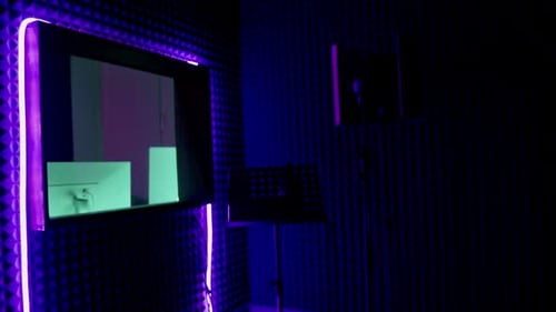 professional recording studio song recording equipment microphone close-up bottom view purple