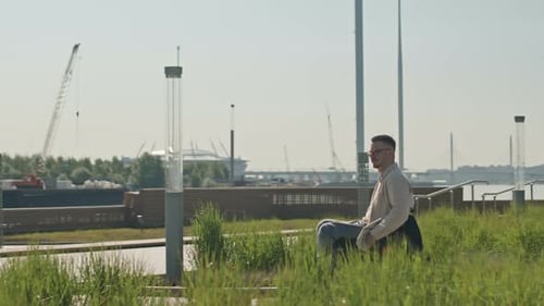 Man with Disability Riding in Wheelchair Outdoors