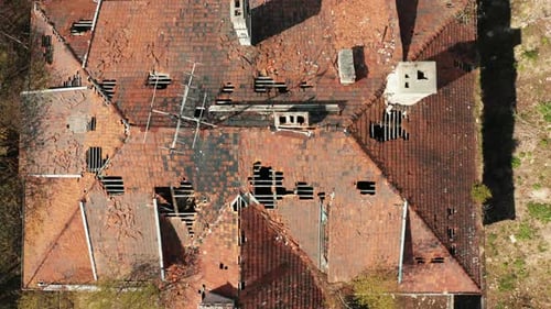 Aerial View of an Abandoned Old Country House Standing in the Forest
