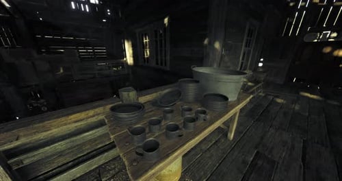 Old Wooden Table with Pottery and Kitchenware in Dimly Lit Workshop