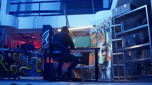 Hooded Hacker Leaving Neon Lit Underground Shelter After Launching DDoS Attack